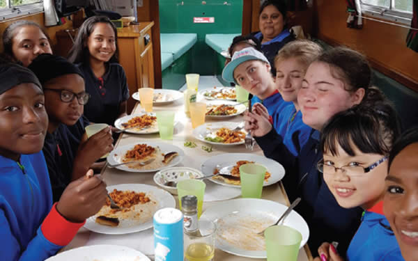 Children enjoying lunch on the Angel Boat