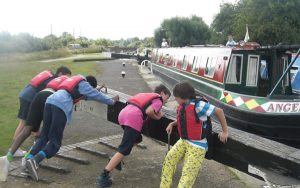 Children helping with the lock for the canal boat